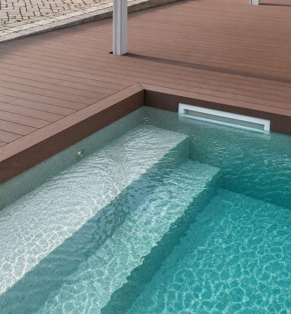 WPC poolside decking with steps into the water